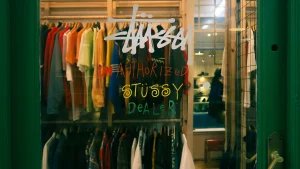 a-store-window-with-a-sign-that-says-shop-scaled